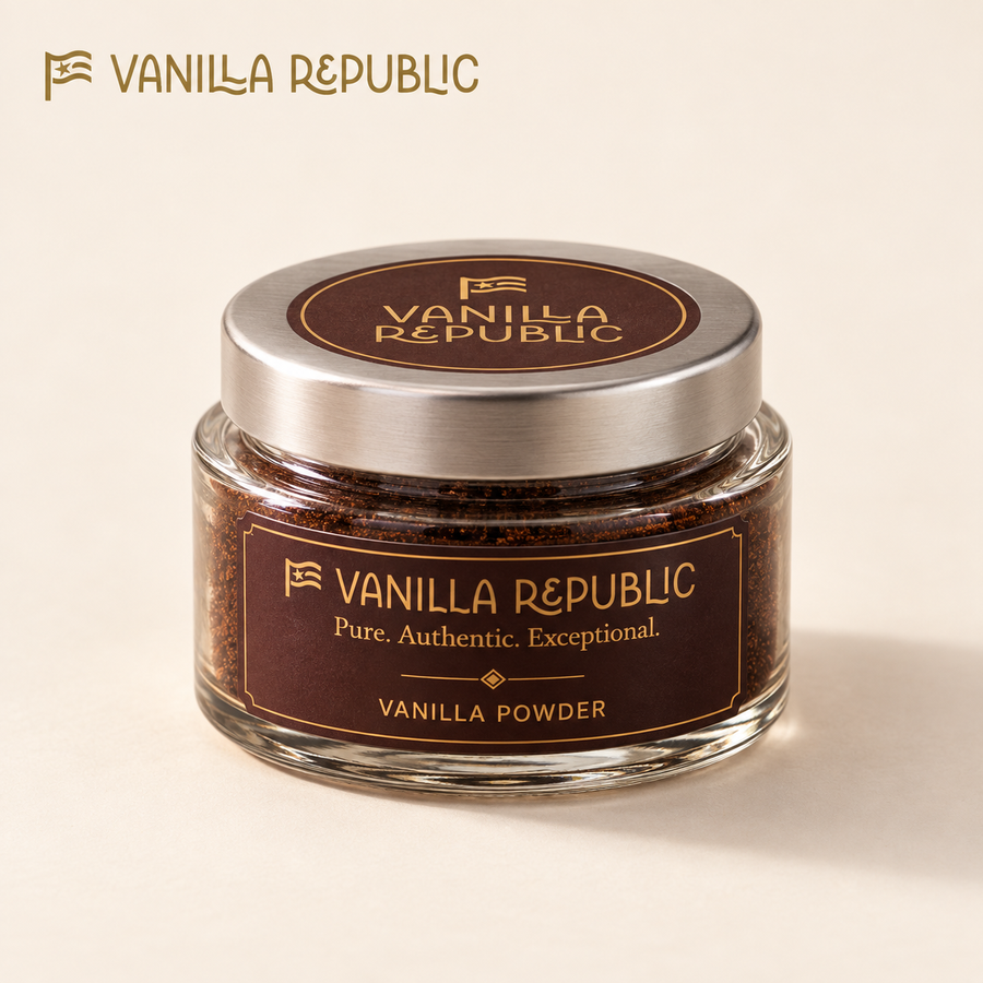 Vanilla Republic powder in a short glass jar with silver lid on a warm cream background